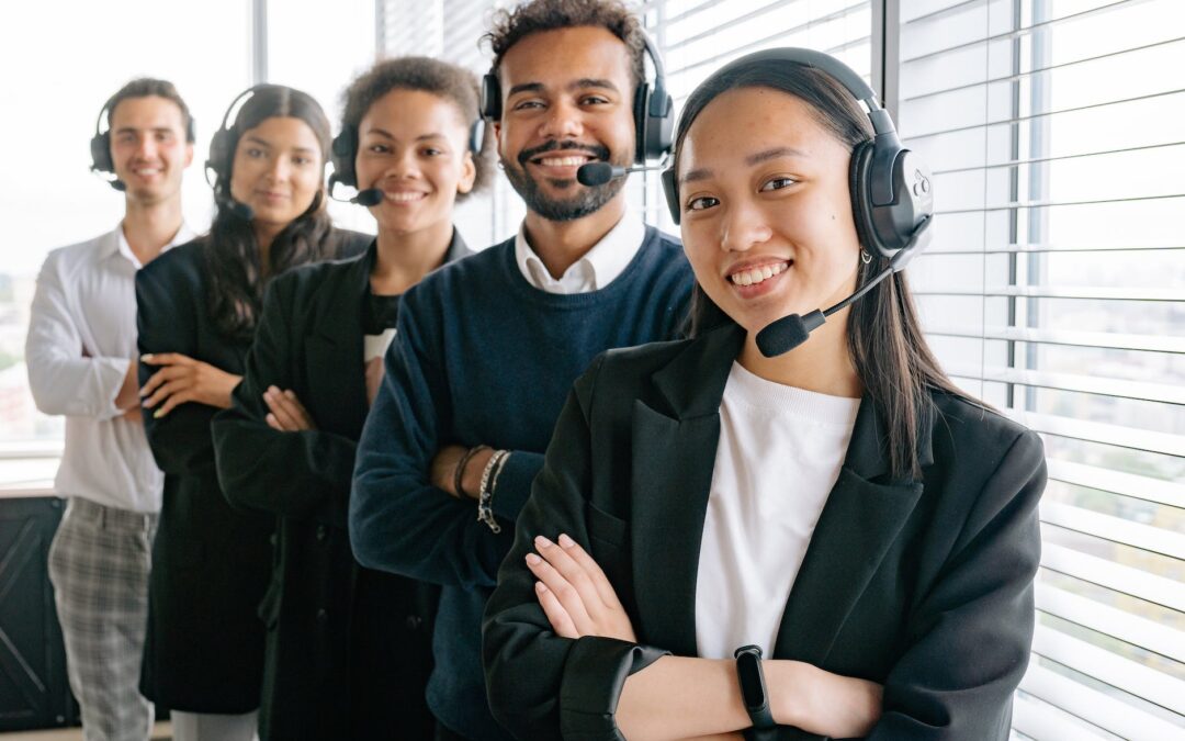 happy call center agents looking at camera